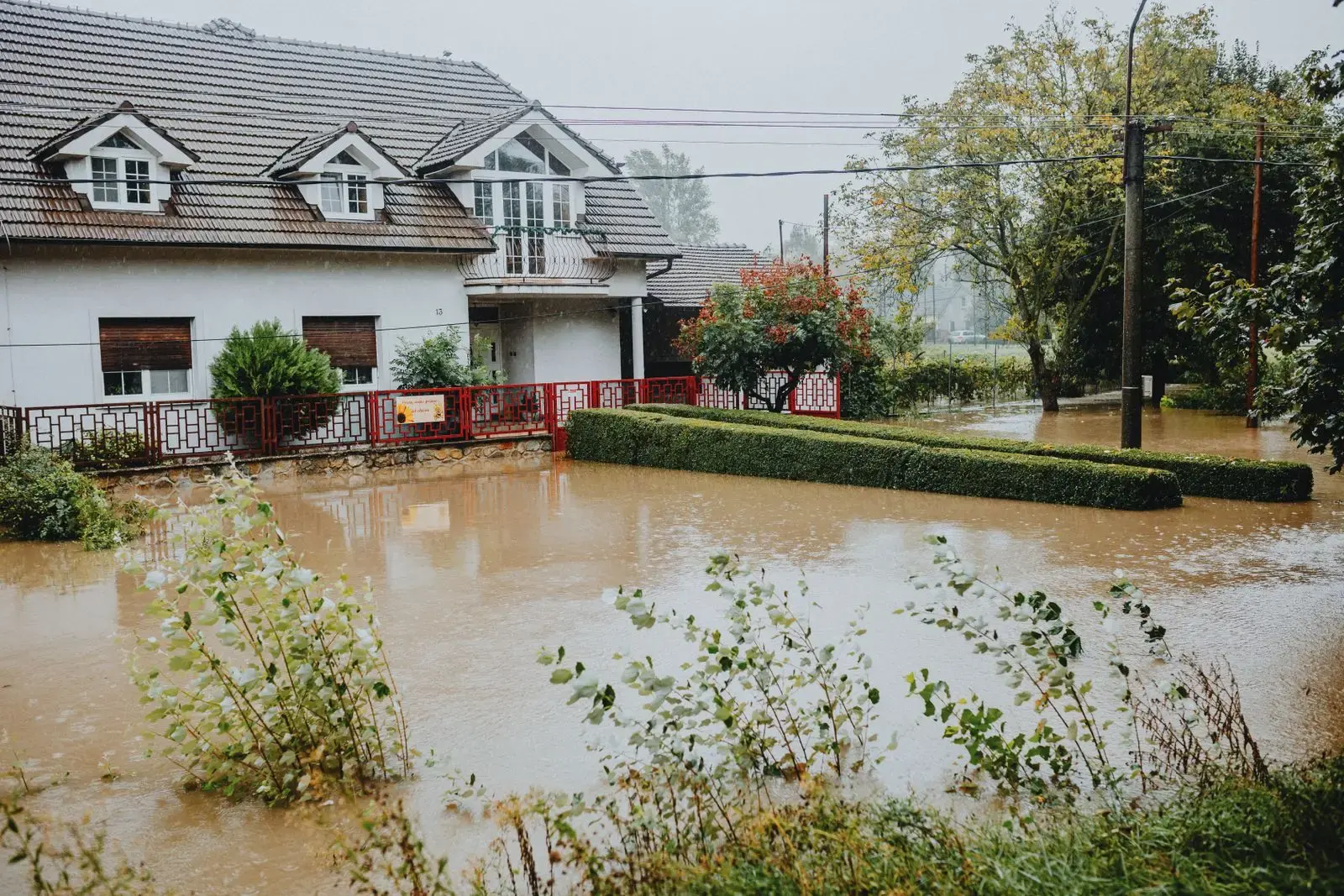 House surrounded by flood water after heavy rain